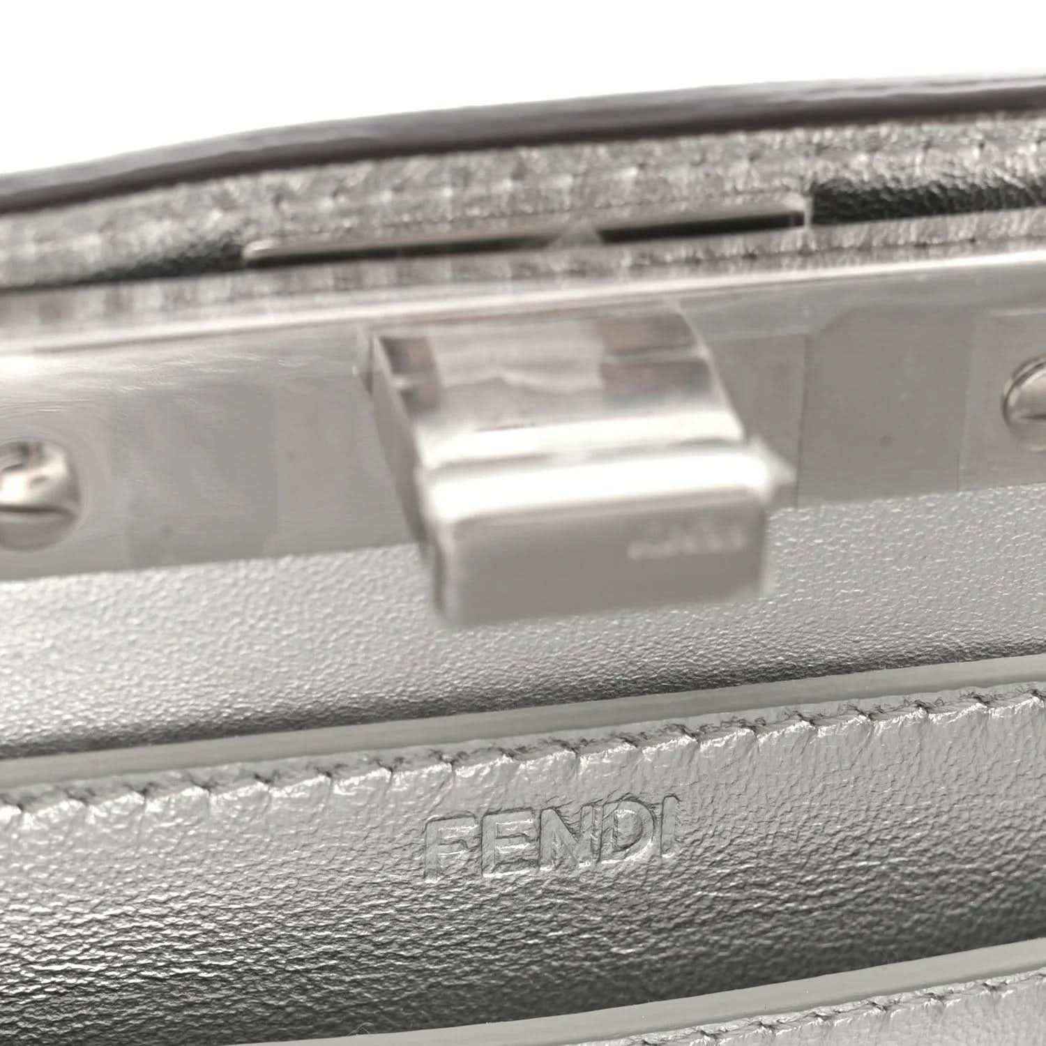 Silver satchel clasp plate with stitched leather trim and FENDI embossing
