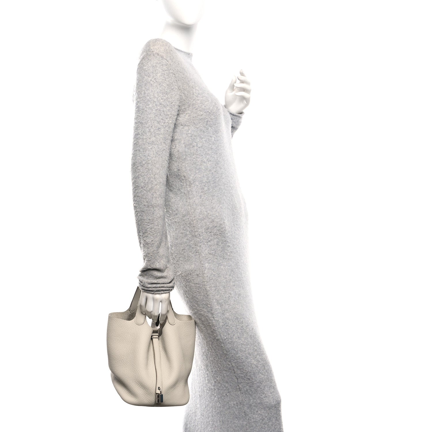Ivory leather tote bag with short handles, carried in hand