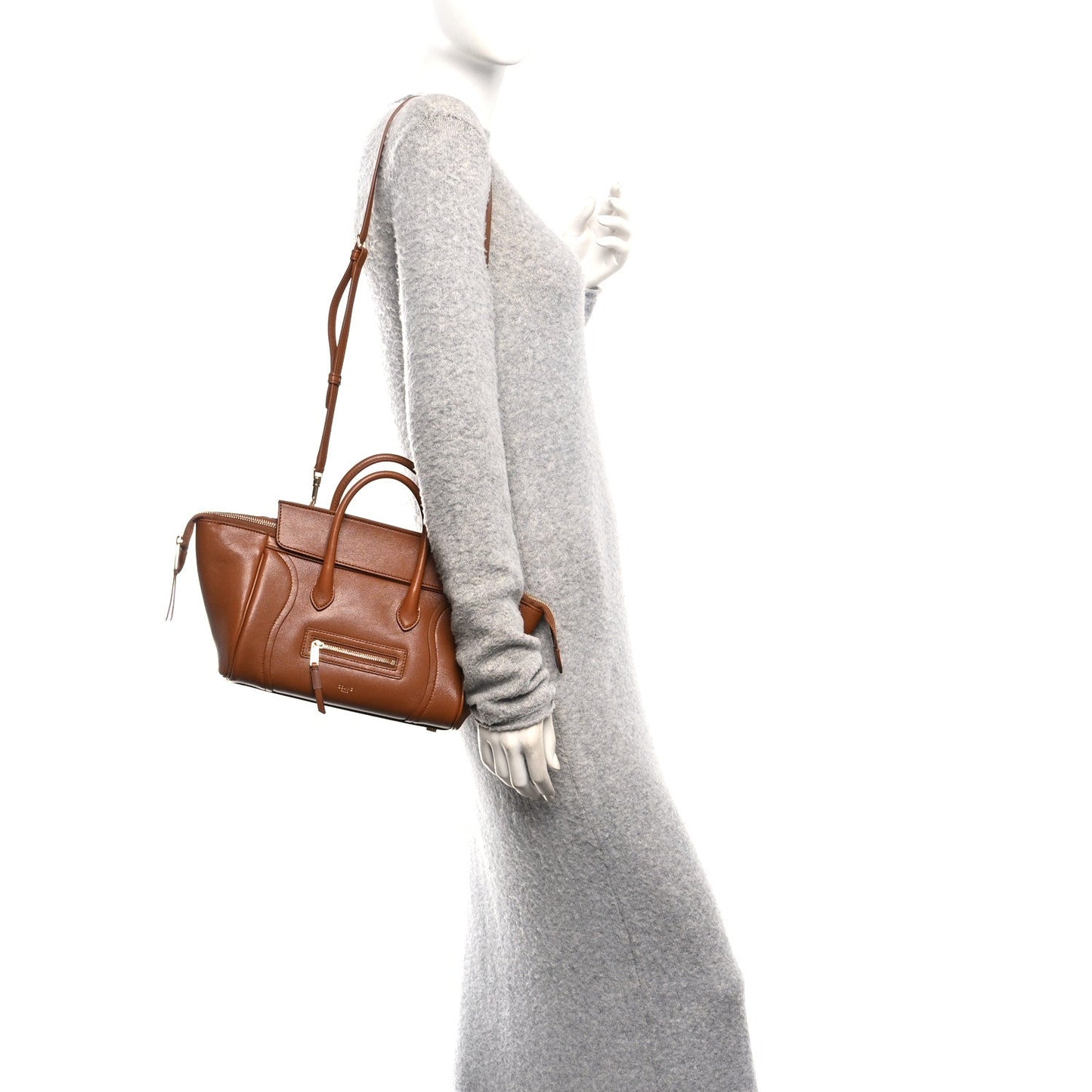 Tan leather small handbag with shoulder strap, zip pocket, and gold-tone hardware.