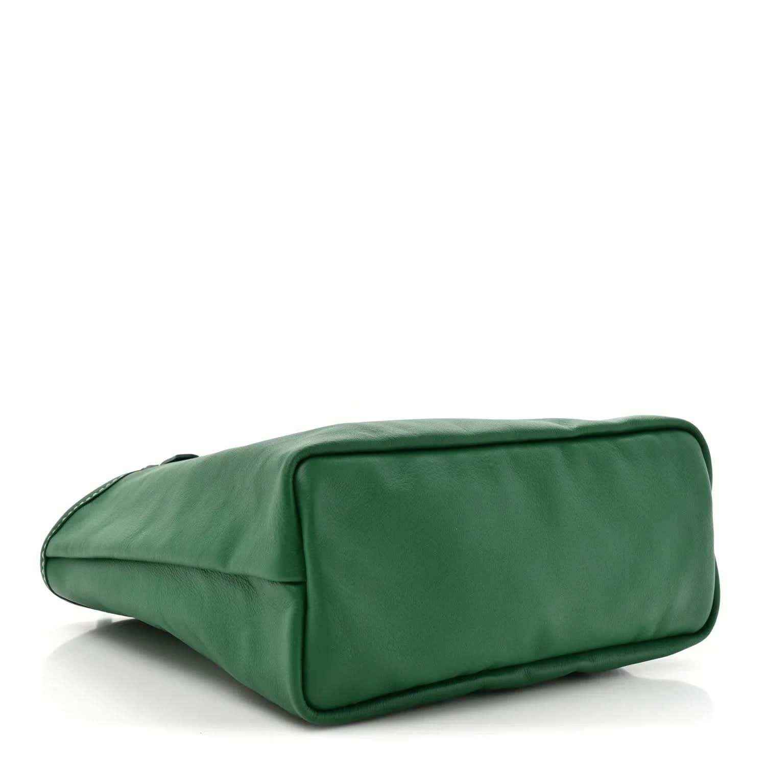 Green smooth reversible tote bag laid on its side with rounded rectangular shape