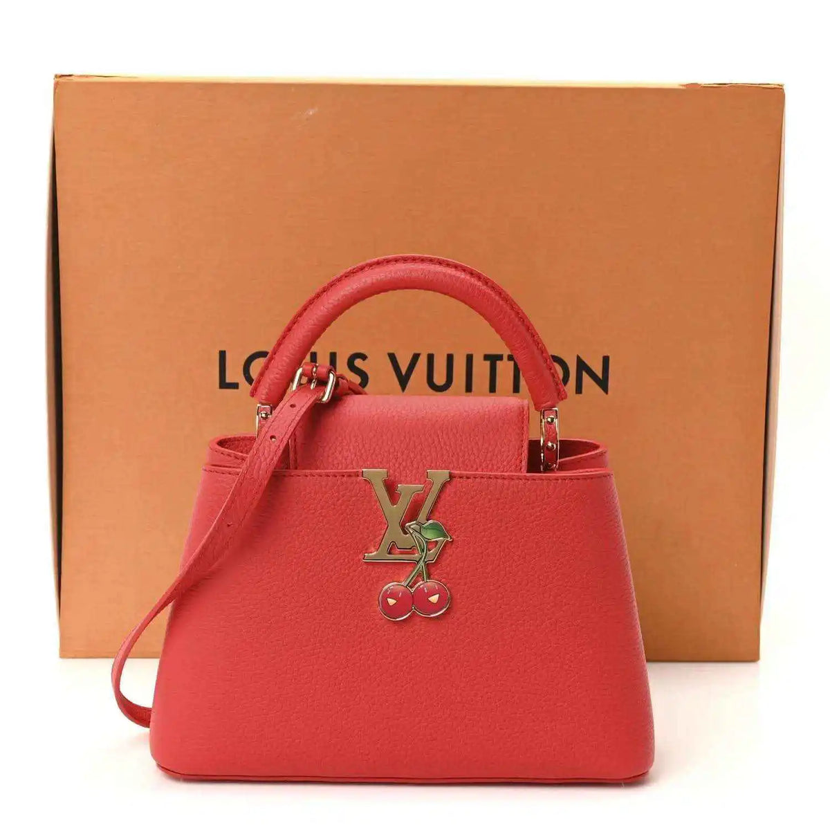 Red leather mini handbag with LV cherry charm, top handles, and included dust bag.