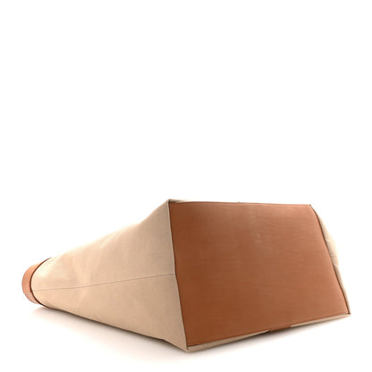 Tan canvas Y tote with brown base panel and wide open structure