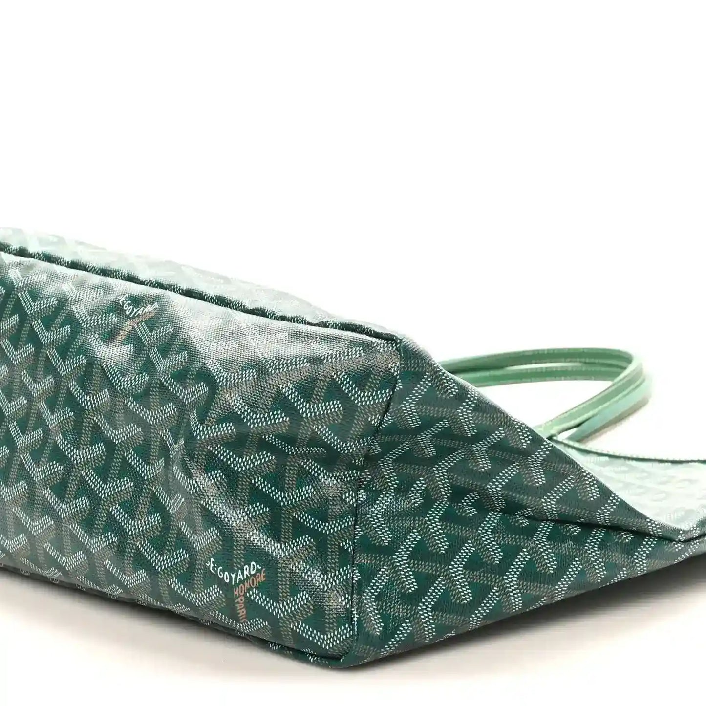 Green canvas tote bag with repeating pattern, top handles, small logo patch
