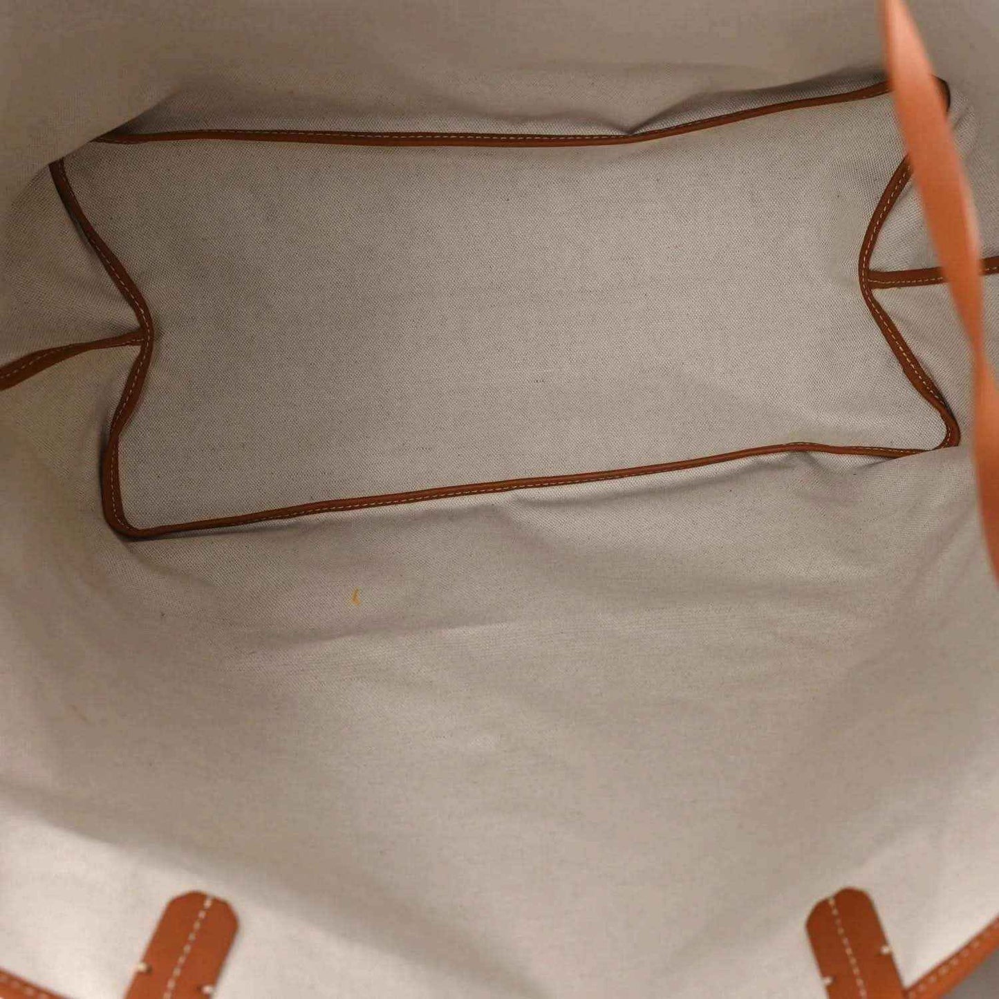 Tote bag interior with beige lining and tan leather trim