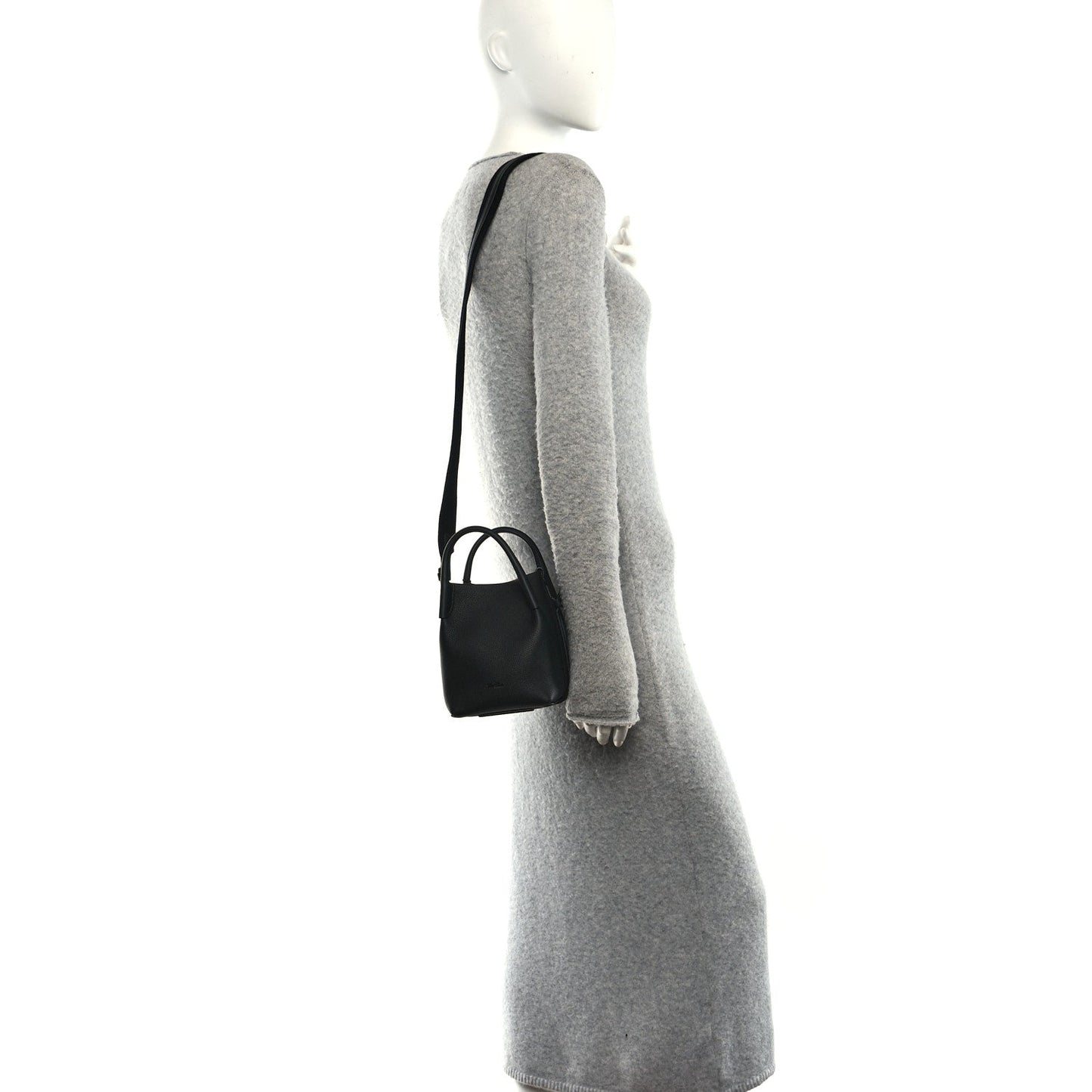 Black micro bale bag on shoulder strap, small grained leather silhouette