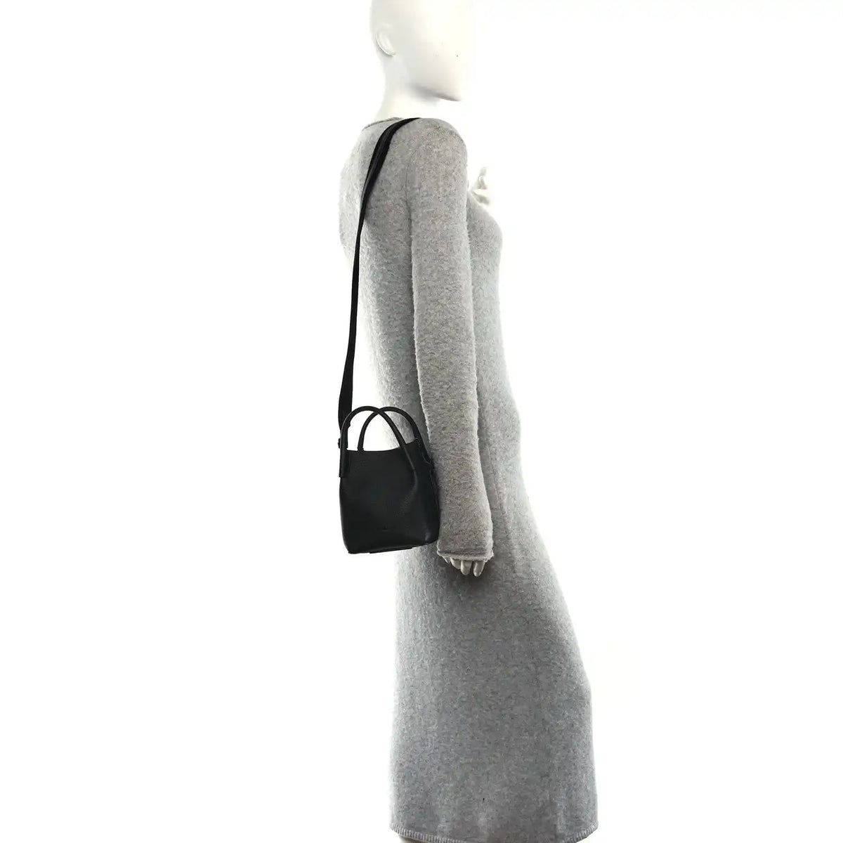Black micro bale bag on shoulder strap, small grained leather silhouette