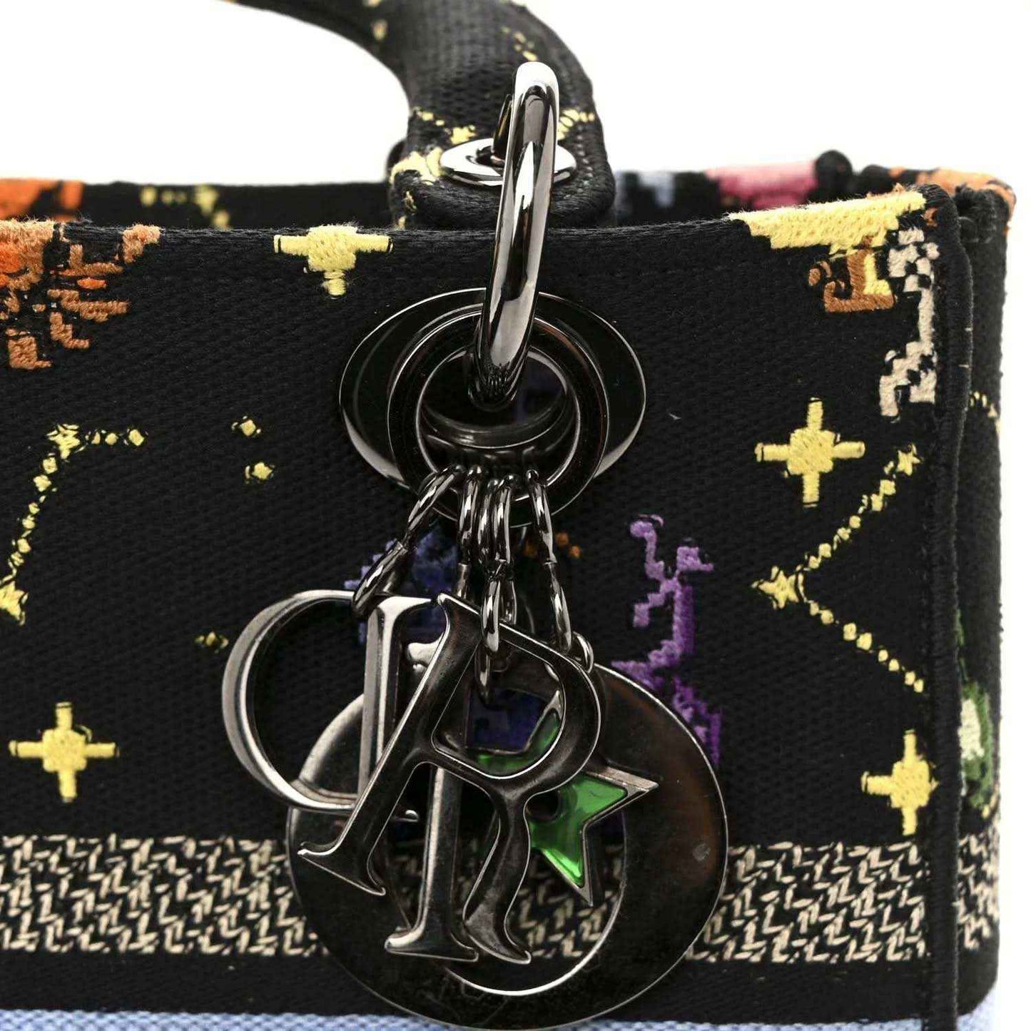 Black canvas bag front with metal ring clasp and zodiac charm keyring