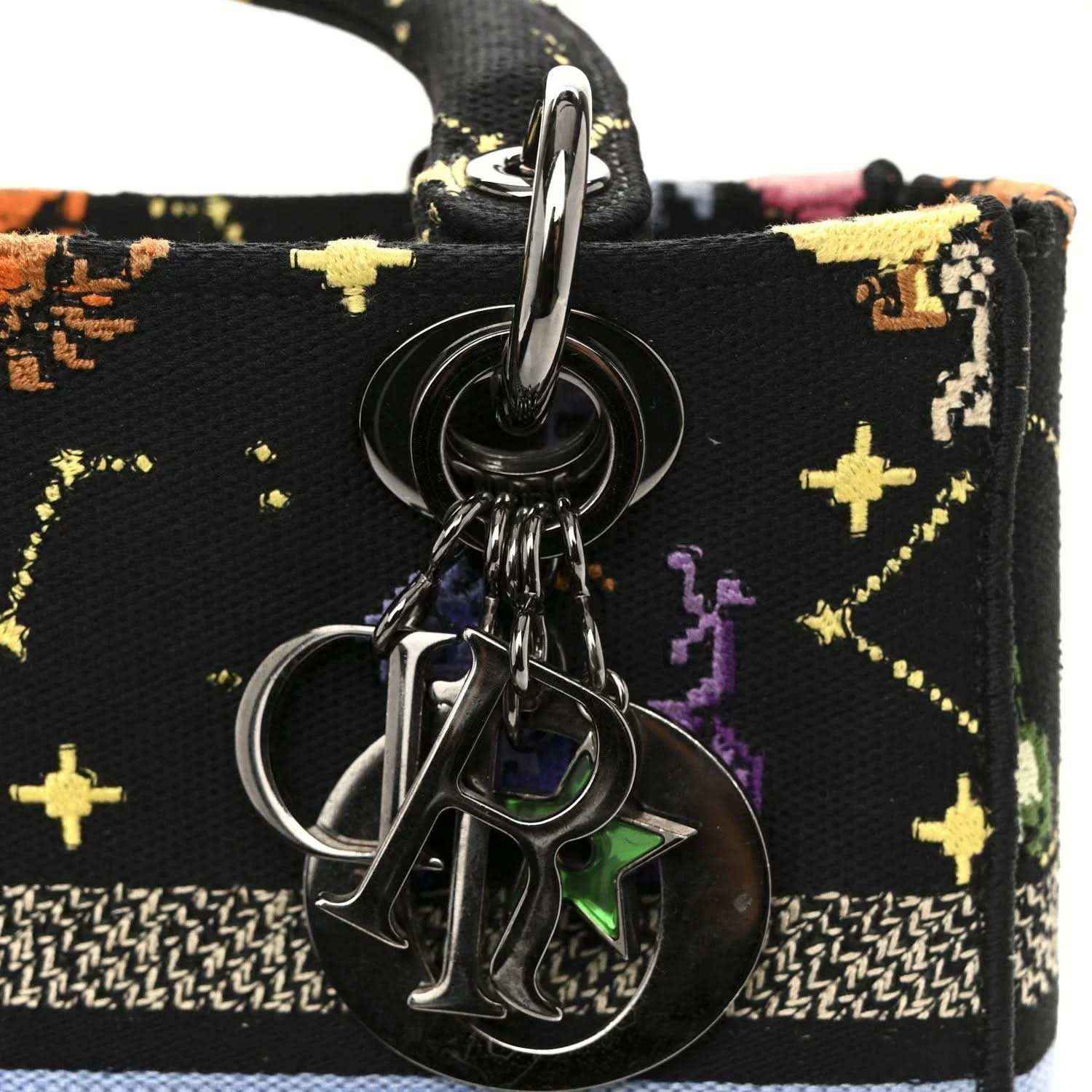 Black canvas bag front with metal ring clasp and zodiac charm keyring