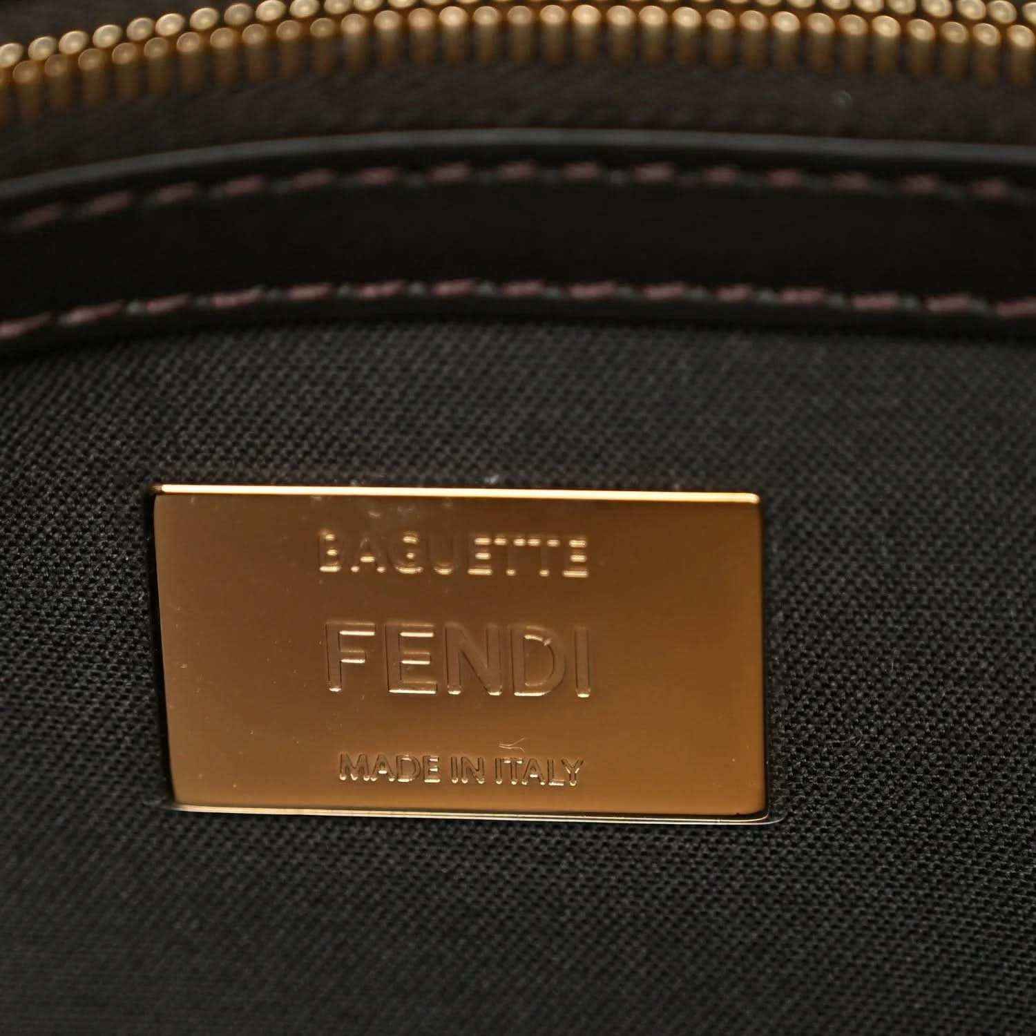 Fendi baguette bag brand plaque with 'FENDI' text in gold tone