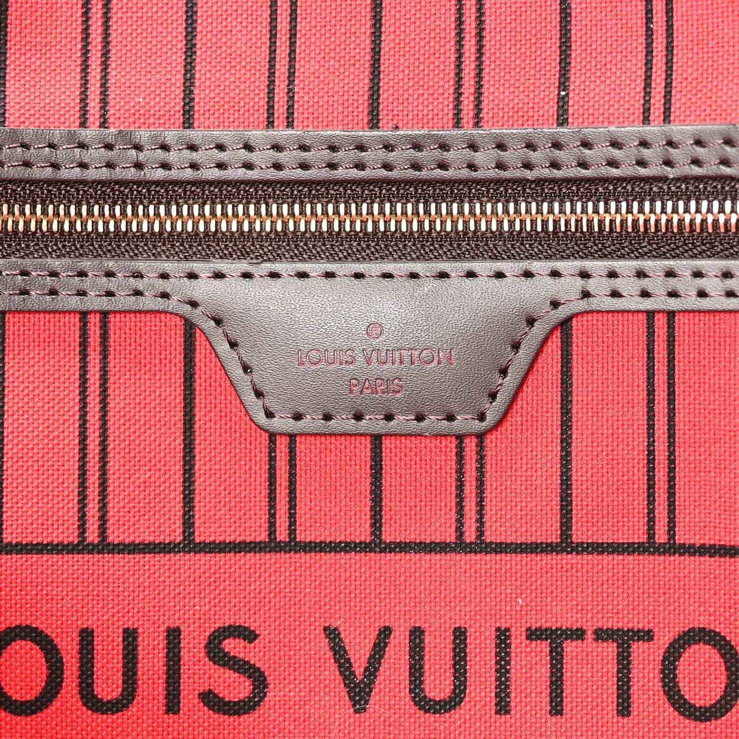 Tote bag leather logo patch and stitching on red striped lining panel