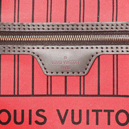 Tote bag leather logo patch and stitching on red striped lining panel