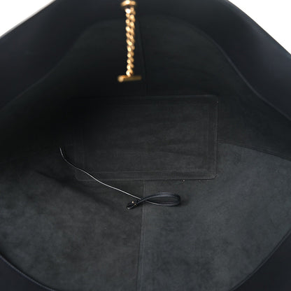 Black leather tote interior with slip pocket and thin hanging chain strap