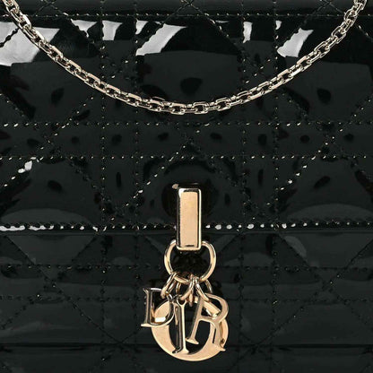 Black patent cannage Lady Dior pouch front view with Dior clasp and chain link