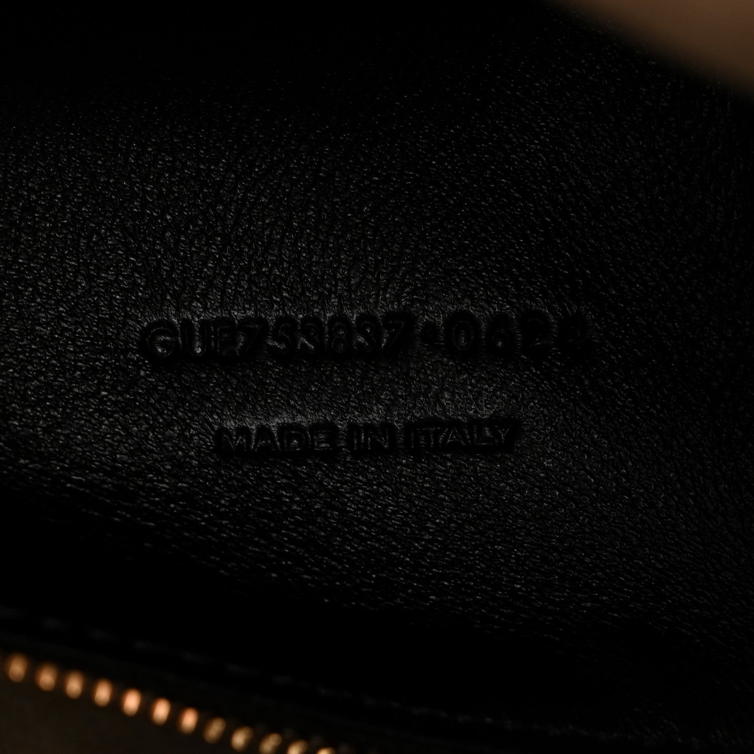 Saint Laurent embossed branding on smooth leather surface, made in Italy