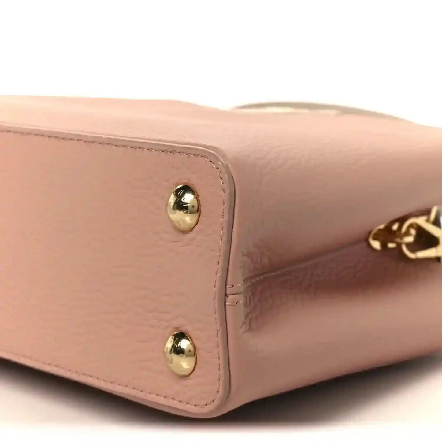 Rose leather handbag corner with gold stud hardware and LV charm detail