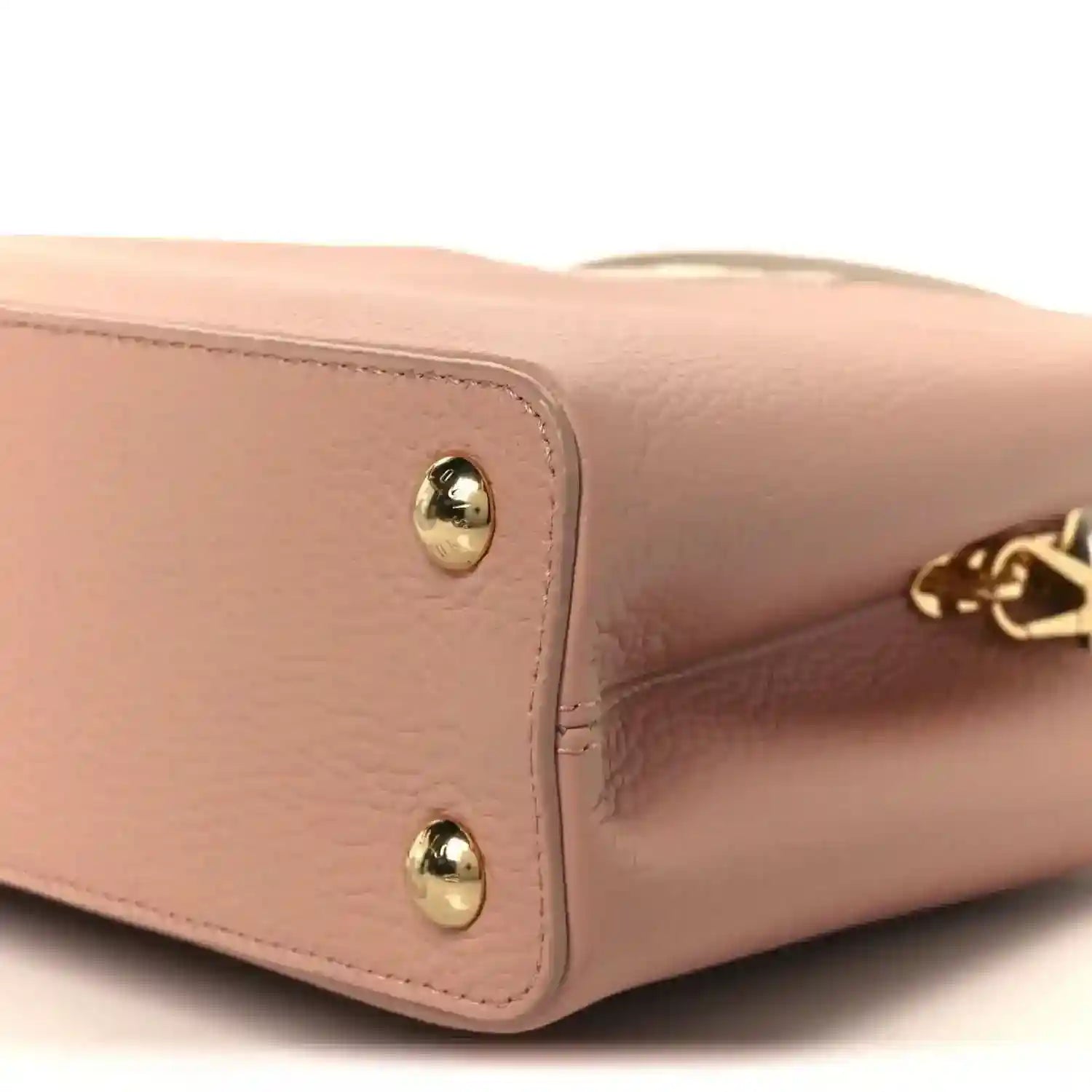 Rose leather handbag corner with gold stud hardware and LV charm detail