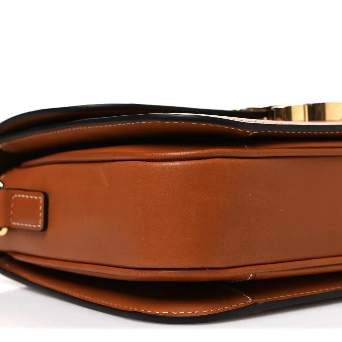 Tan leather crossbody bag showing top closure, gold-tone hardware, and stitched edges.