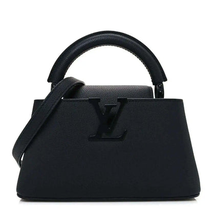 Louis Vuitton mini handbag in matte black leather with top handles and LV emblem.