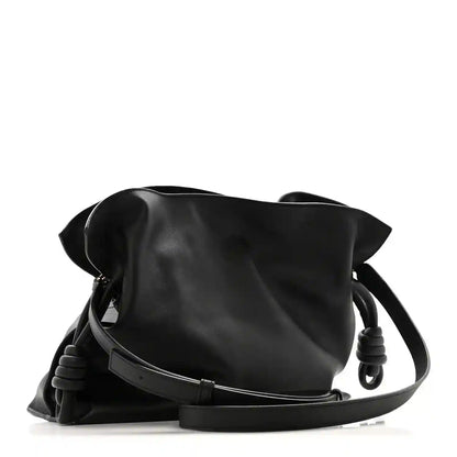 Black calfskin Flamenco knot clutch with braided leather shoulder strap