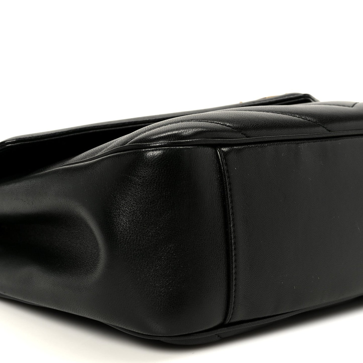 Black leather shoulder bag with smooth side panel and top handle
