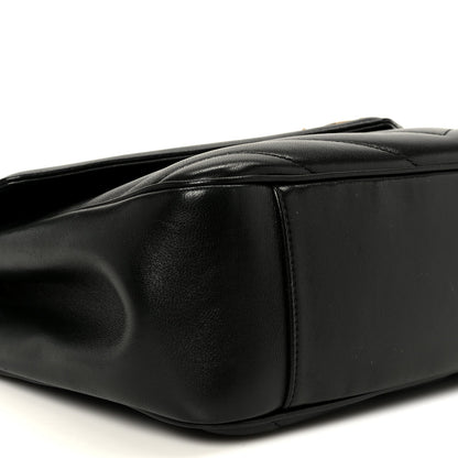 Black leather shoulder bag with smooth side panel and top handle