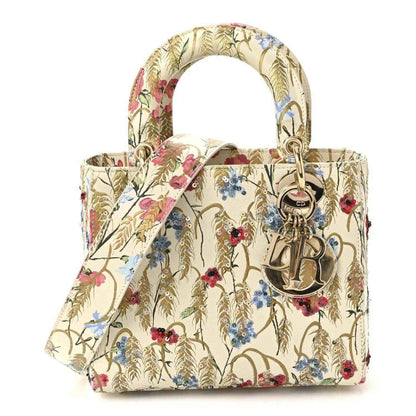 Embroidered floral tote bag with top handles and gold-tone CD hardware