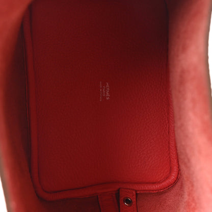 Red leather interior panel with embossed brand stamp near inner pocket