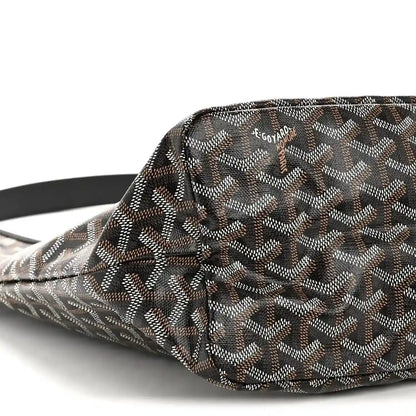 Goyard hobo bag close-up of front corner showing monogram pattern and black strap