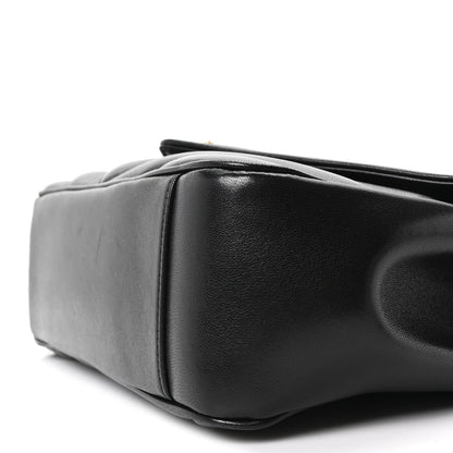 Black medium shoulder bag with structured corners and leather texture