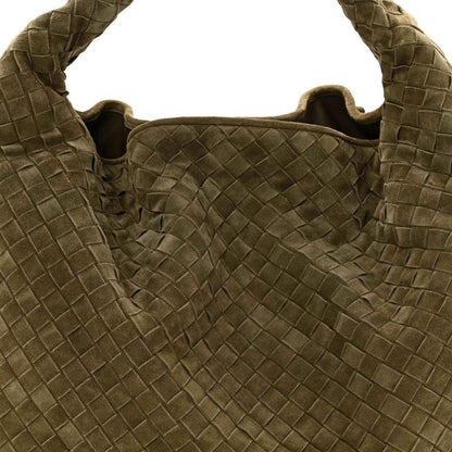 Suede intrecciato hobo bag opening with woven panel and dark lining