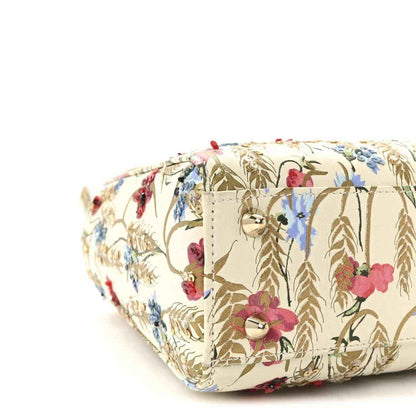 Embroidered floral tote bag with structured sides and cream base
