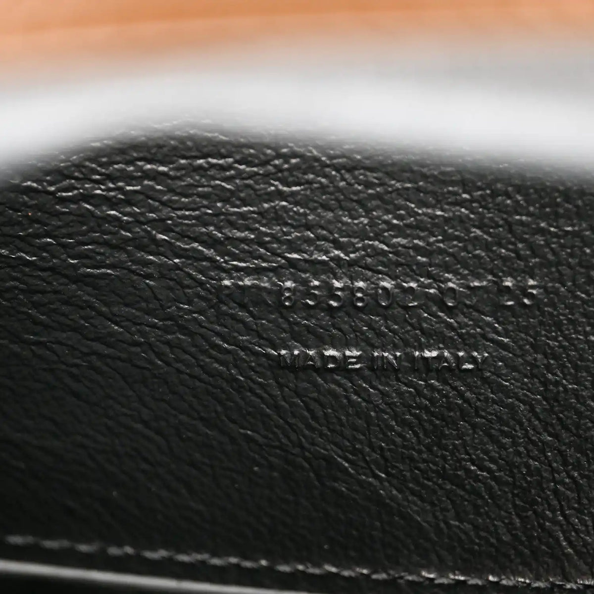 Black leather interior text 'MADE IN ITALY' on pouch lining