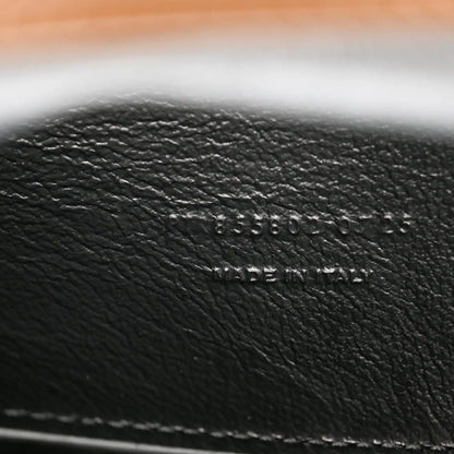 Black leather interior text 'MADE IN ITALY' on pouch lining