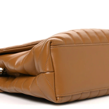Tan quilted leather satchel end with zipper closure and channel stitching