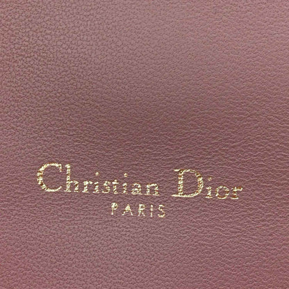 Purple leather with “Christian Dior Paris” embossed text