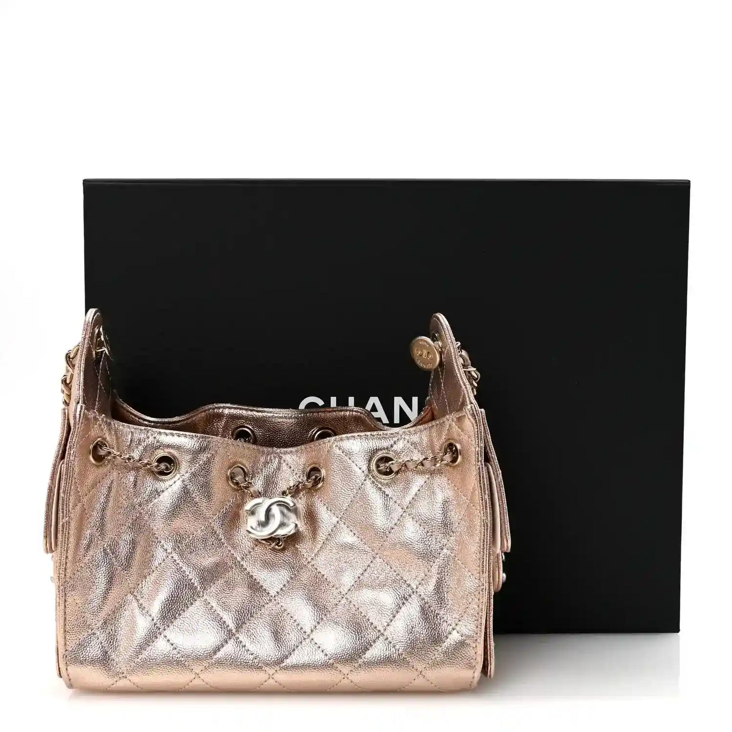 Copper metallic quilted mini handbag with chain strap and Chanel CC front logo.