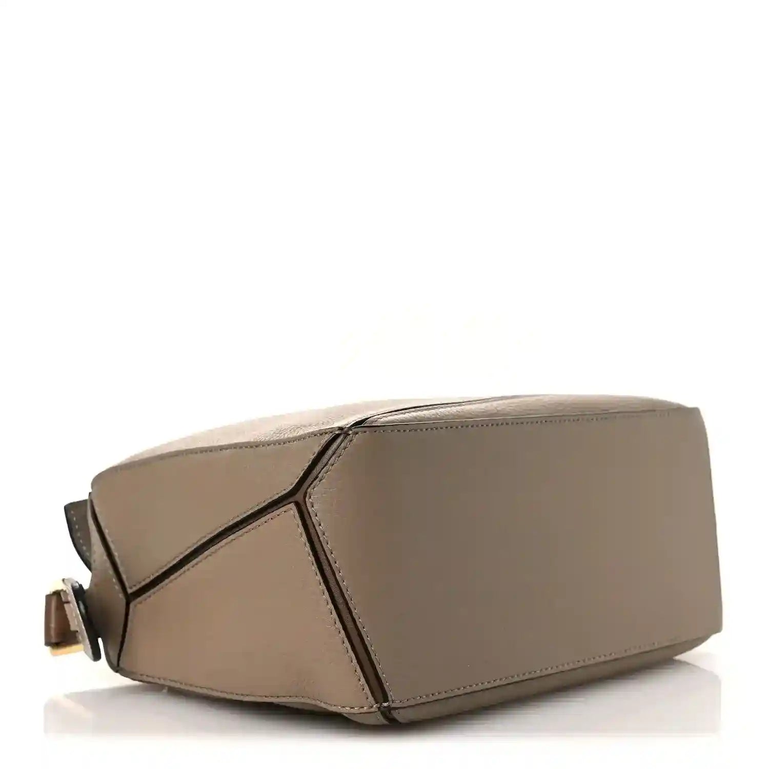 Small Puzzle bag angled view, sand leather with geometric panel detail