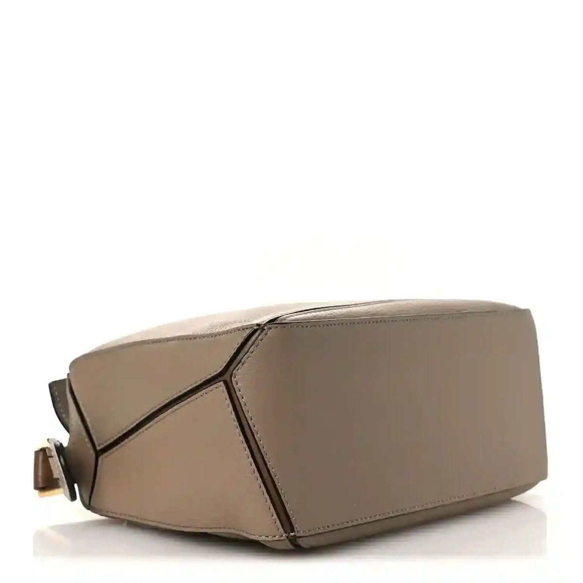 Small Puzzle bag angled view, sand leather with geometric panel detail