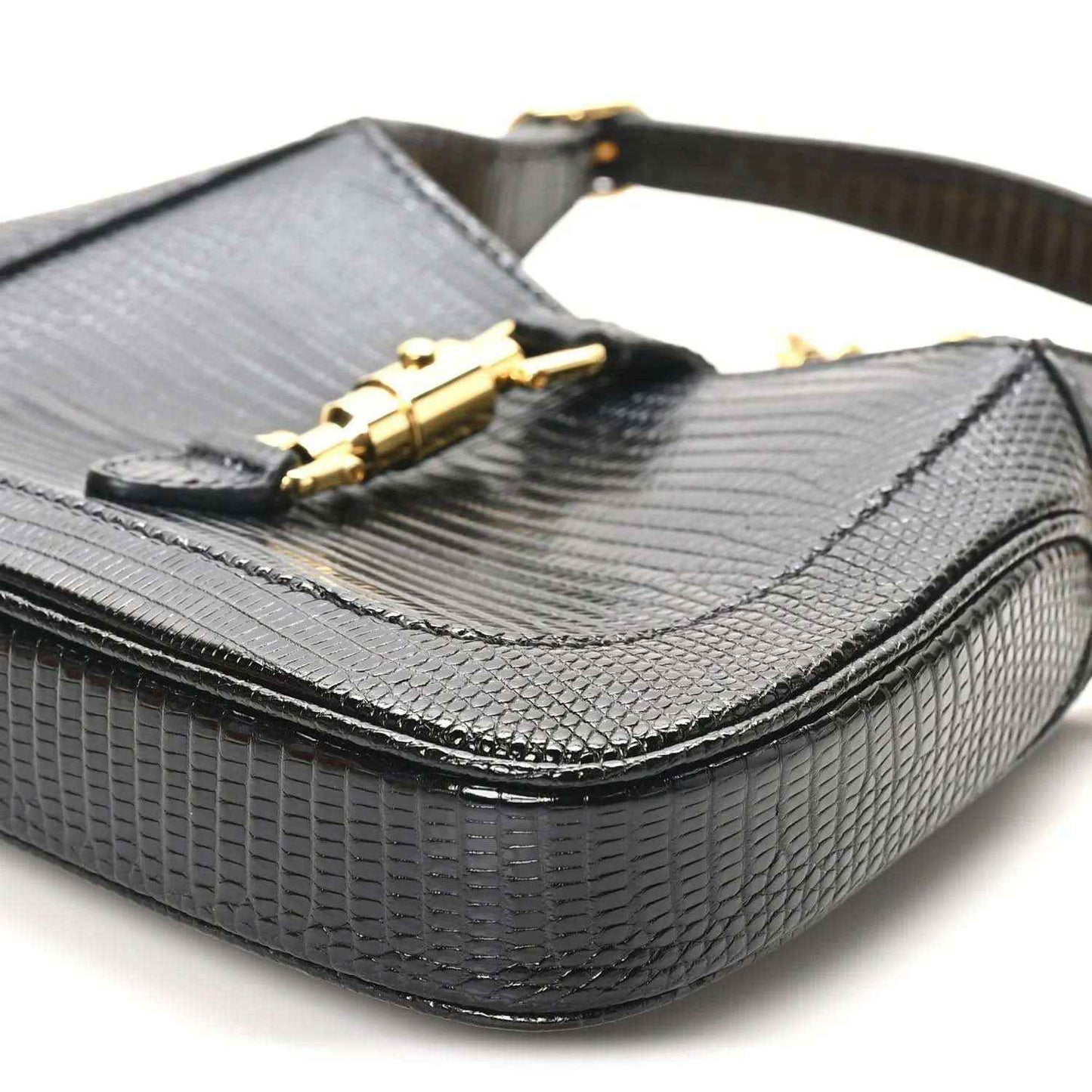 Black lizard mini Jackie handbag with front flap and gold-tone clasp hardware on top.