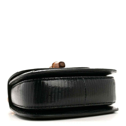 Gucci mini top handle bag side view, black embossed texture and bamboo accent