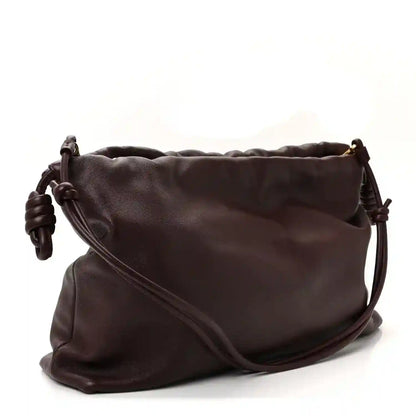 Dark burgundy leather crossbody clutch with curved front seam