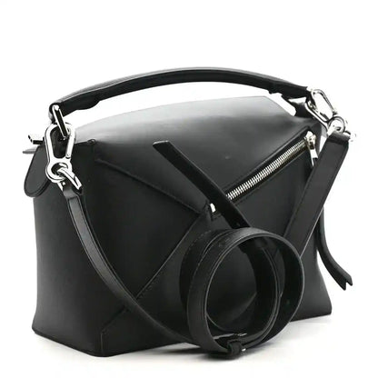 Small Puzzle Edge shoulder bag in black leather with structured top and metal zipper