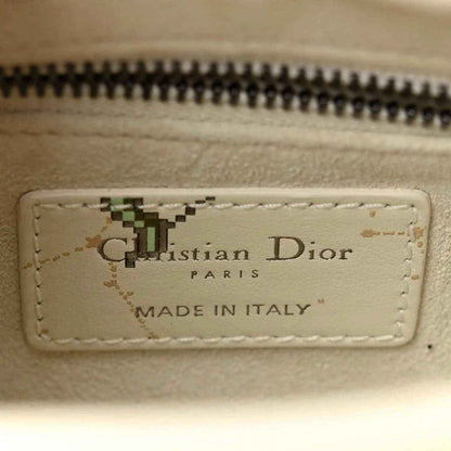 Mini Lady Dior bag interior label with 'Christian Dior' and 'Made in Italy'