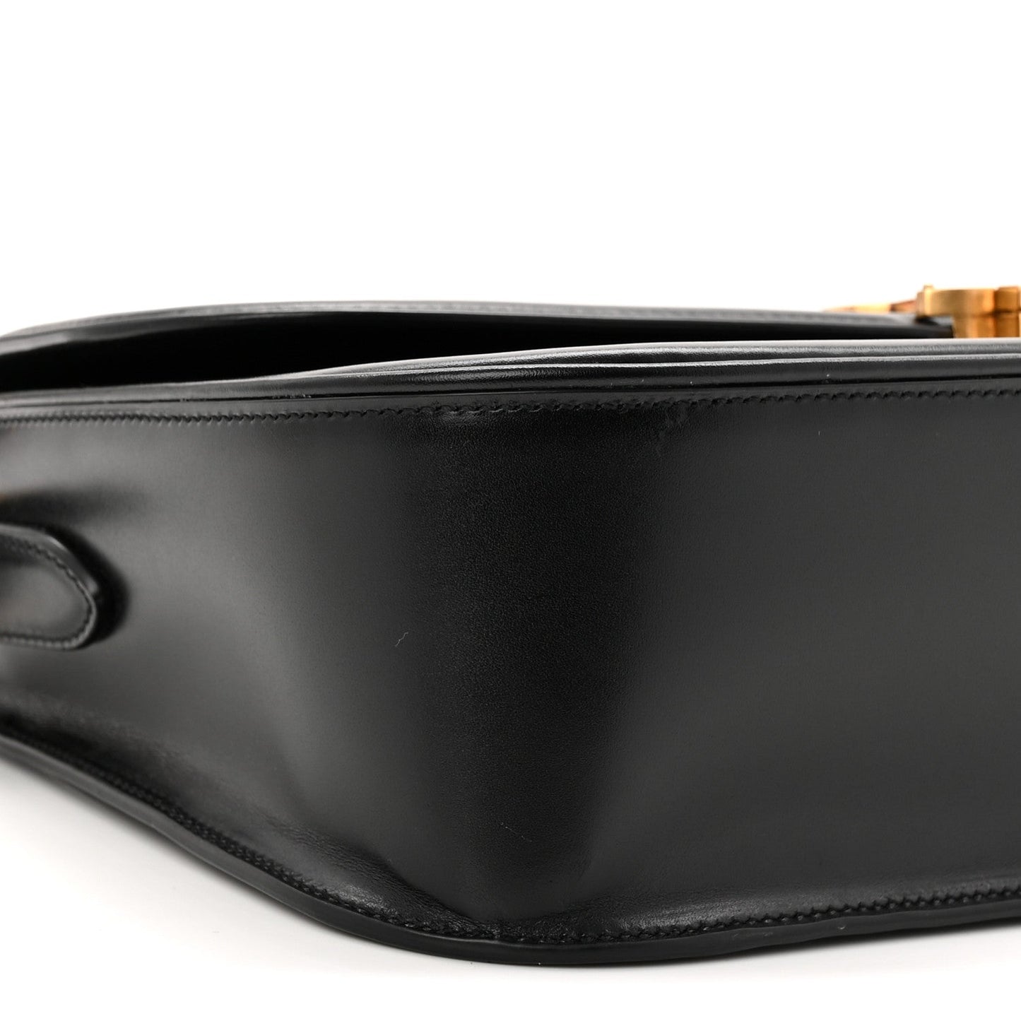 Saint Laurent black leather shoulder bag side view with curved seam