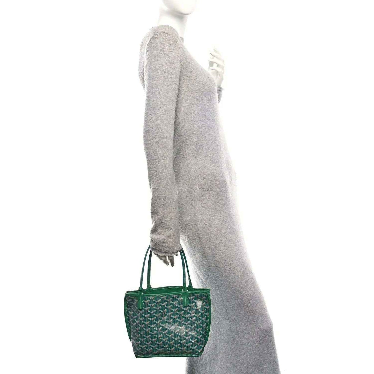 Green mini reversible tote bag with patterned exterior and top handles, shown from the side