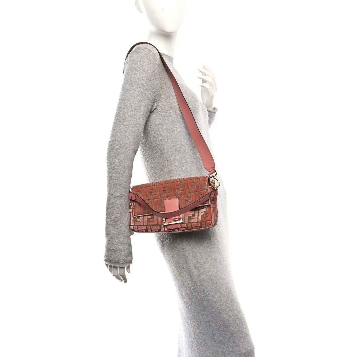 Pink velvet jacquard baguette bag worn crossbody, FF pattern with shoulder strap
