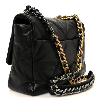 Black quilted leather flap bag with mixed gold and silver-tone chain, side view
