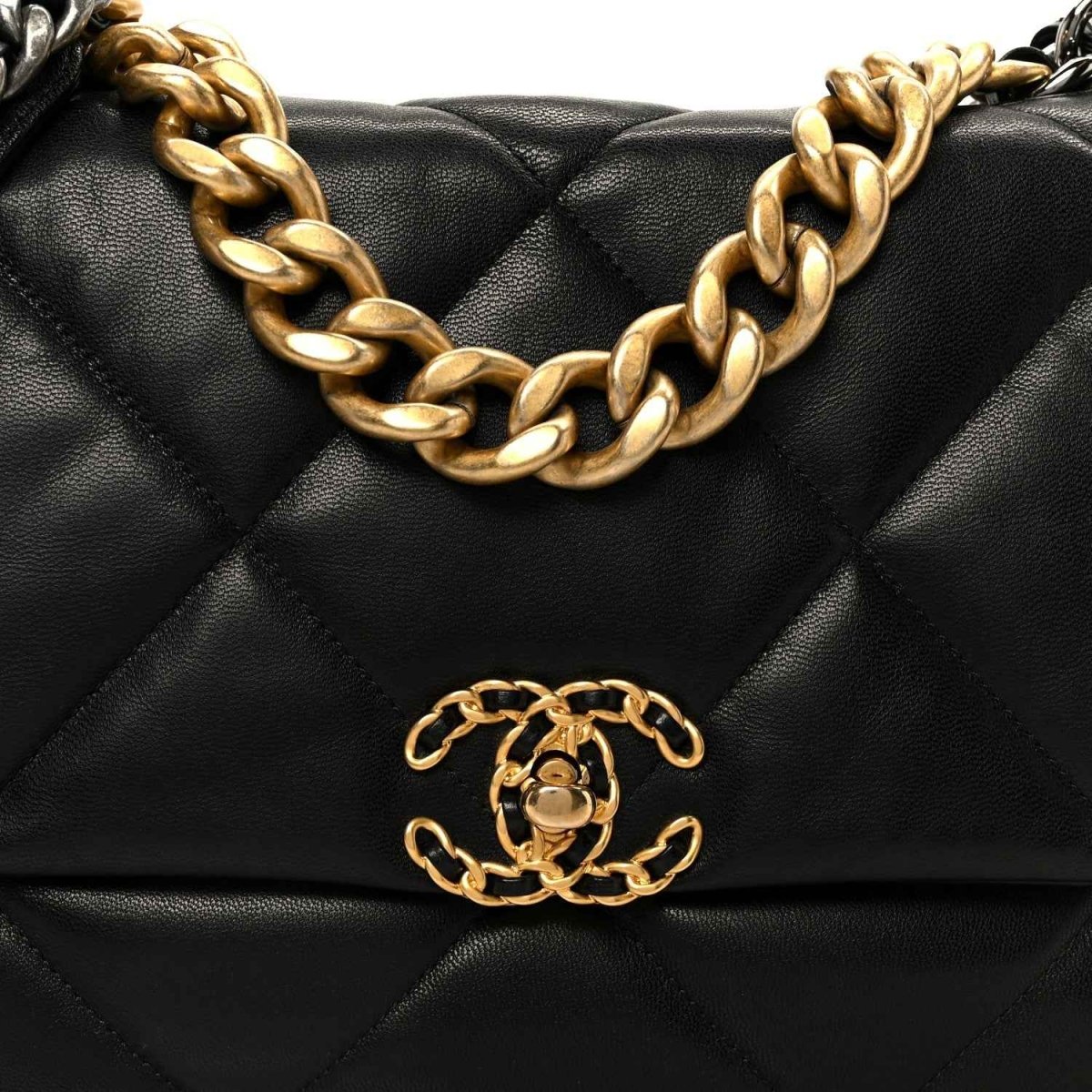 Black quilted leather flap bag front detail with gold-tone chain and logo clasp