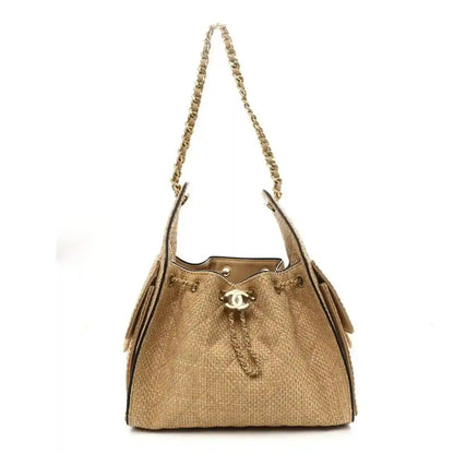 Chanel 25 braided raffia handbag in beige with calfskin trim and gold chain shoulder strap