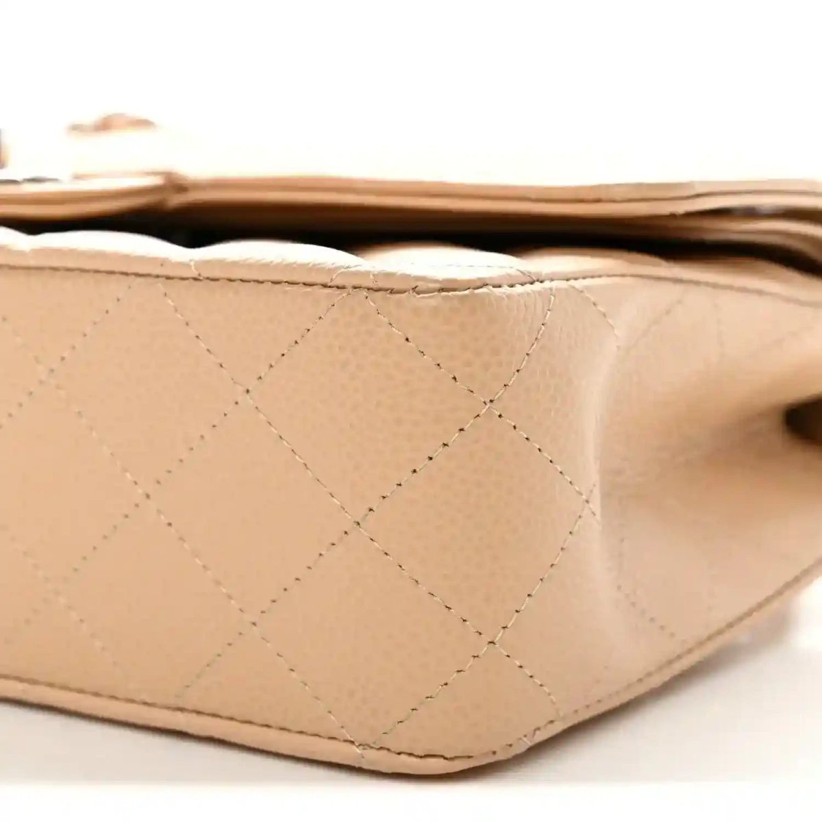Chanel beige quilted caviar bag side panel with diamond stitching and edge trim
